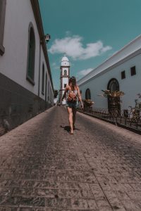 Girl walking backwards church of San Gines, Arrecife, Lanzarote